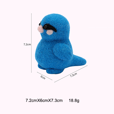 The finished bright blue felted bird, highlighting its striking color.