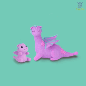 The finished Mother and Baby Dino felted figures, shown nestled together in a protective, loving pose.